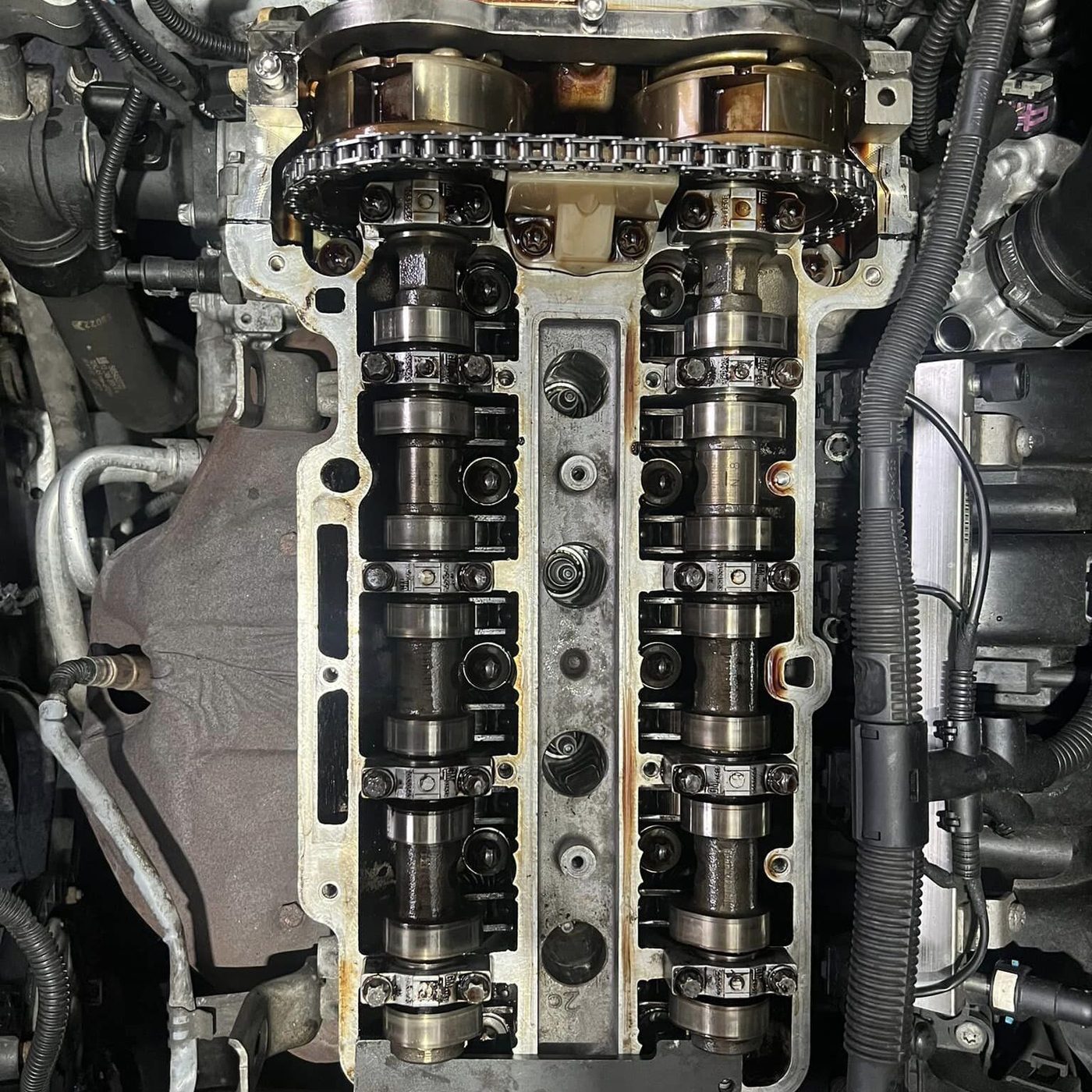 Timing chain and camshafts exposed during an engine repair
