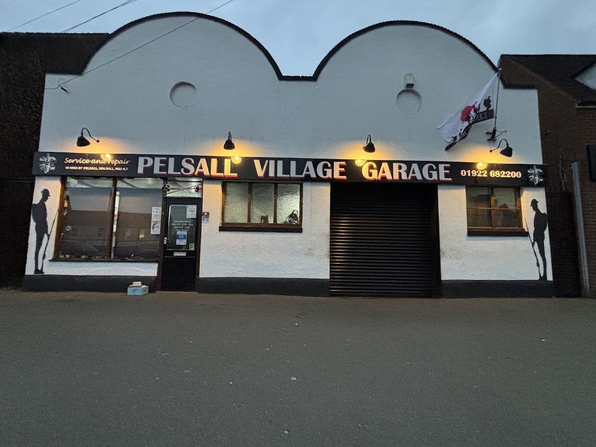 The garage lit up at dusk